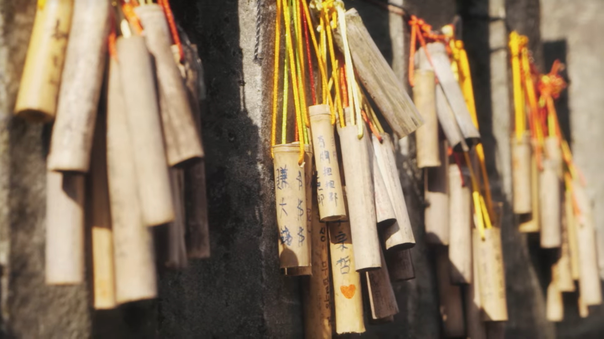 Sticks of bamboo with writing on them.